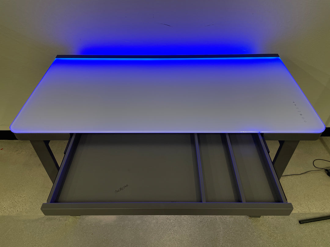 Tresanti Aurora 47” Adjustable Height Desk with LED Lighting (chip on edge of glass top)